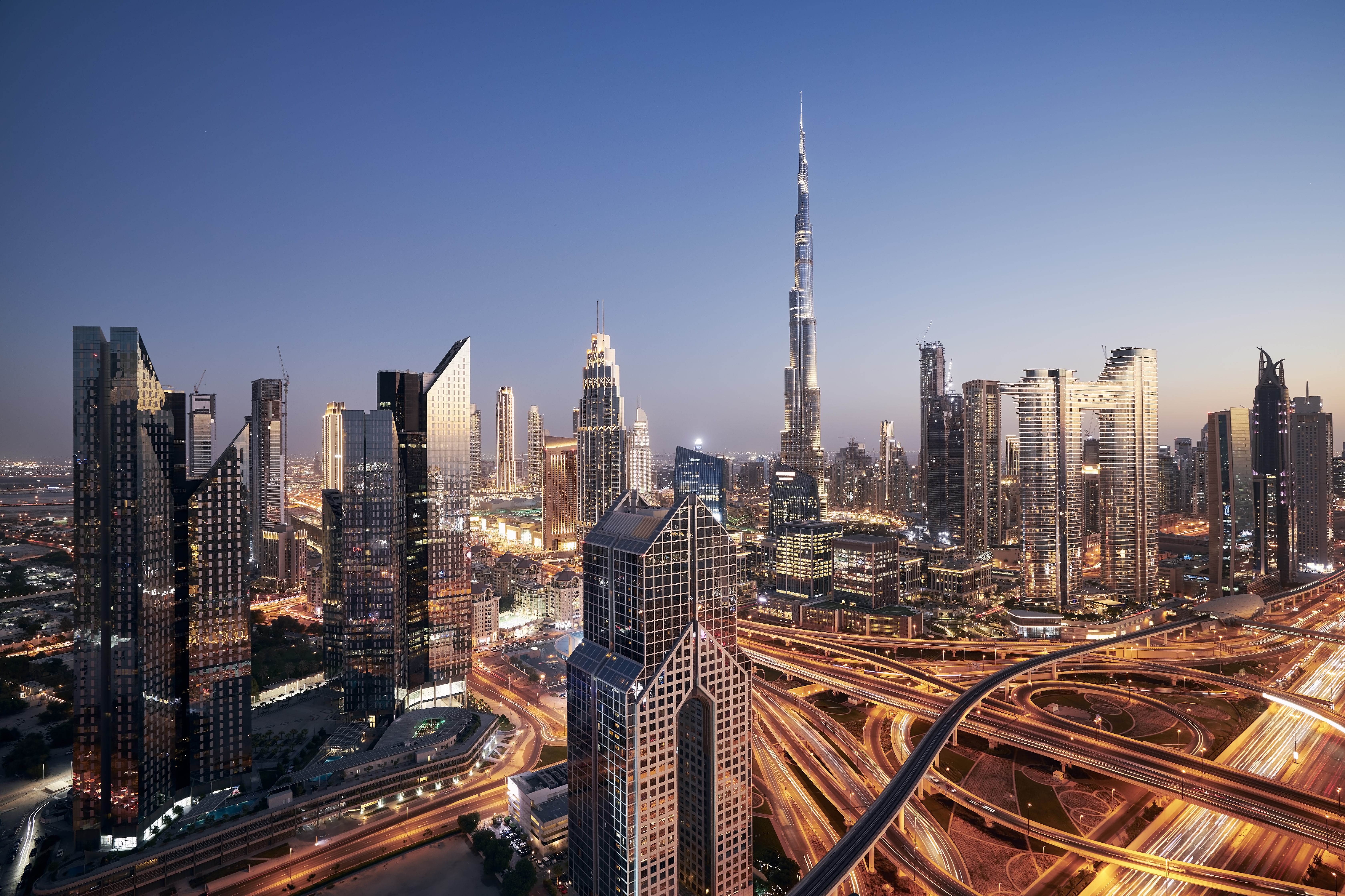 Dubai cityscape at night. Illuminated urban skyline with Burj Khalifa. United Arab Emirates."n