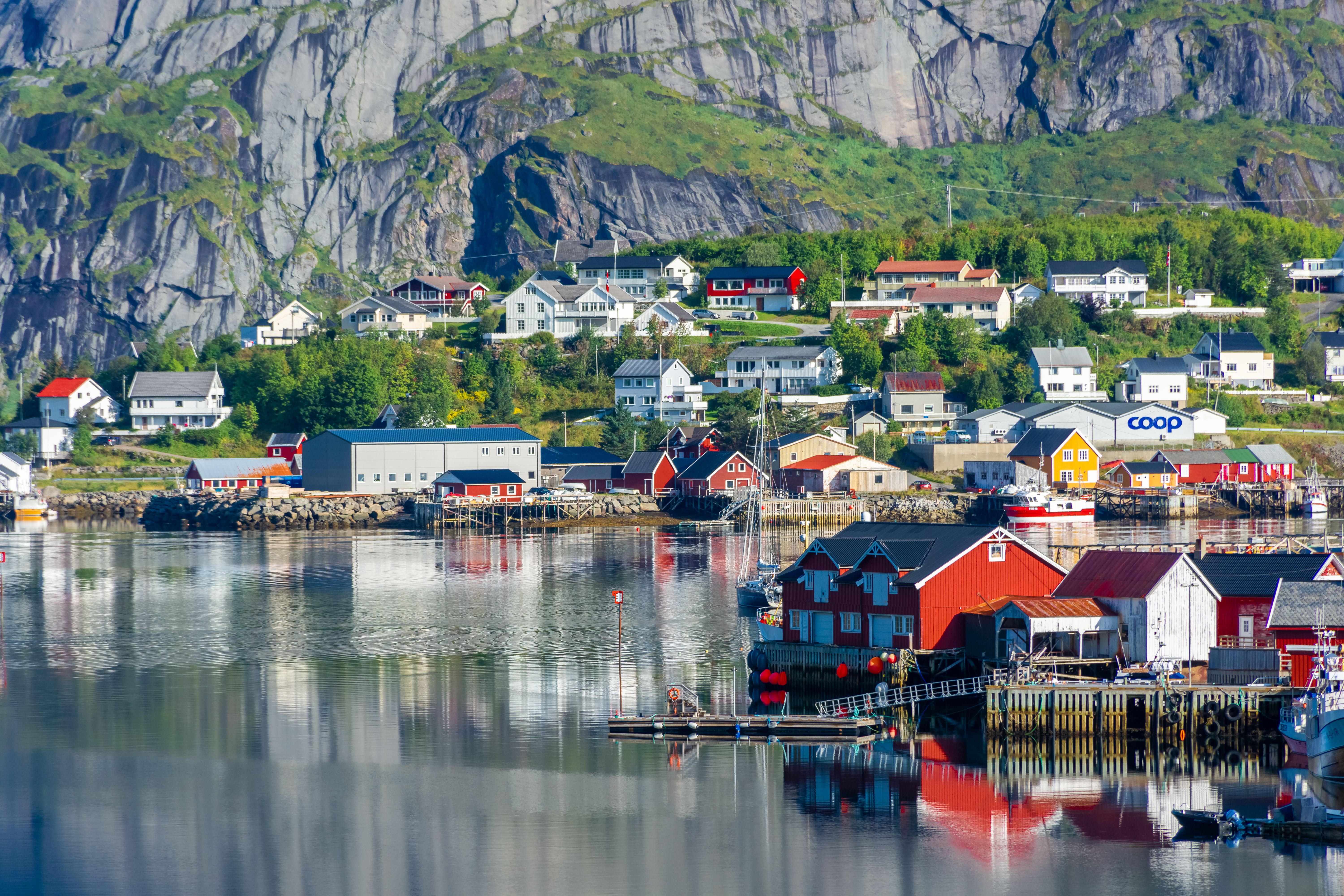Perfect reflection of the Reine village on the water of the fjord in the Lofoten Islands, Norway