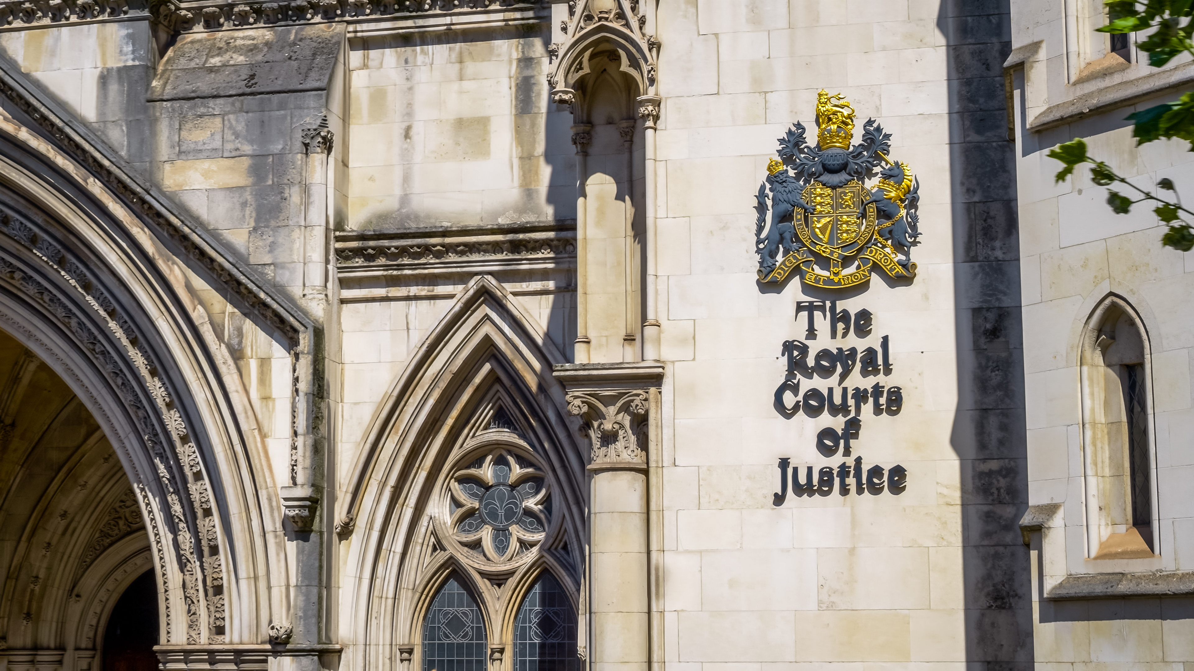 London, UK - 11th August 2024: The Royal Courts of Justice in London, England. The building houses both the High Court and Court of Appeal of England and Wales. Designed by George Edmund Street, it is a large grey stone edifice in the Victorian Gothic style built in the 1870s and opened by Queen Victoria in 1882. It is located on the Strand within the City of Westminster