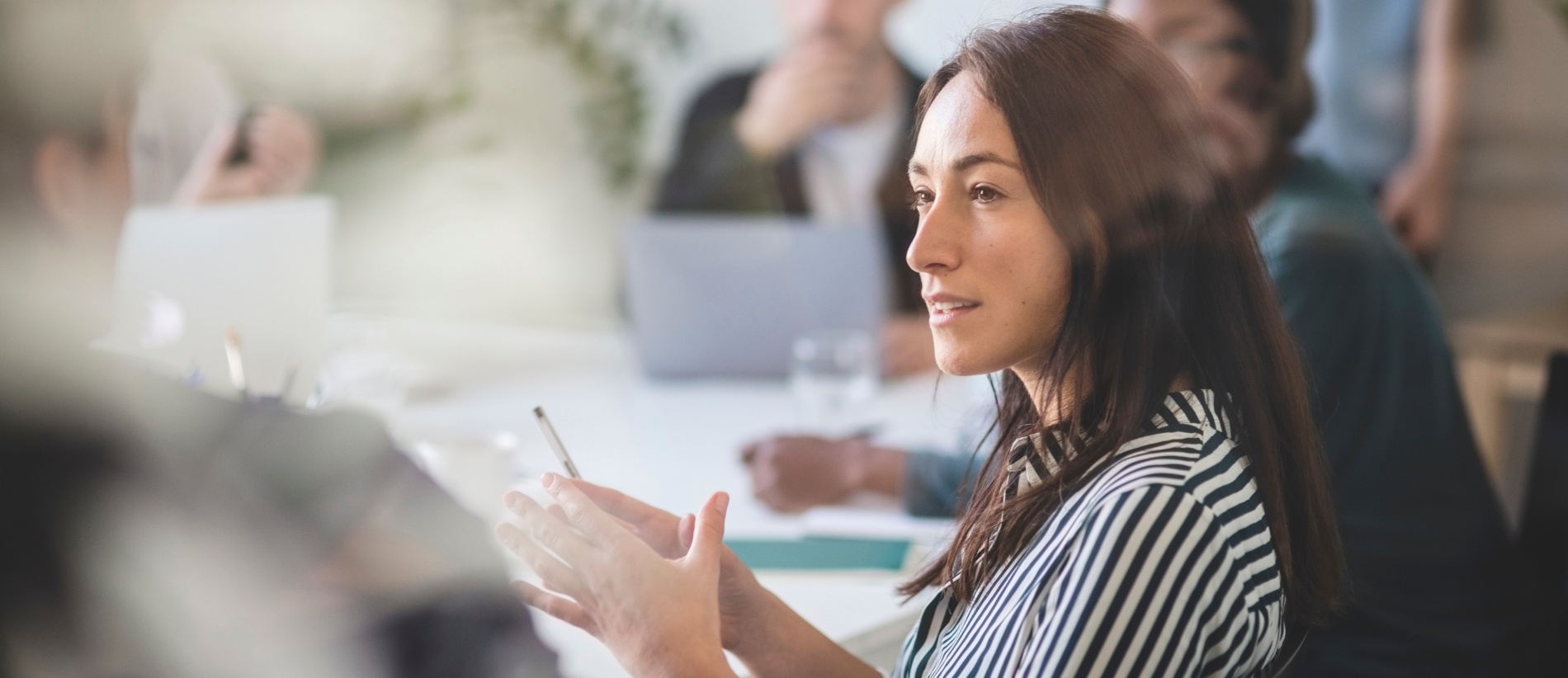 Businesswoman in discussion at office meeting