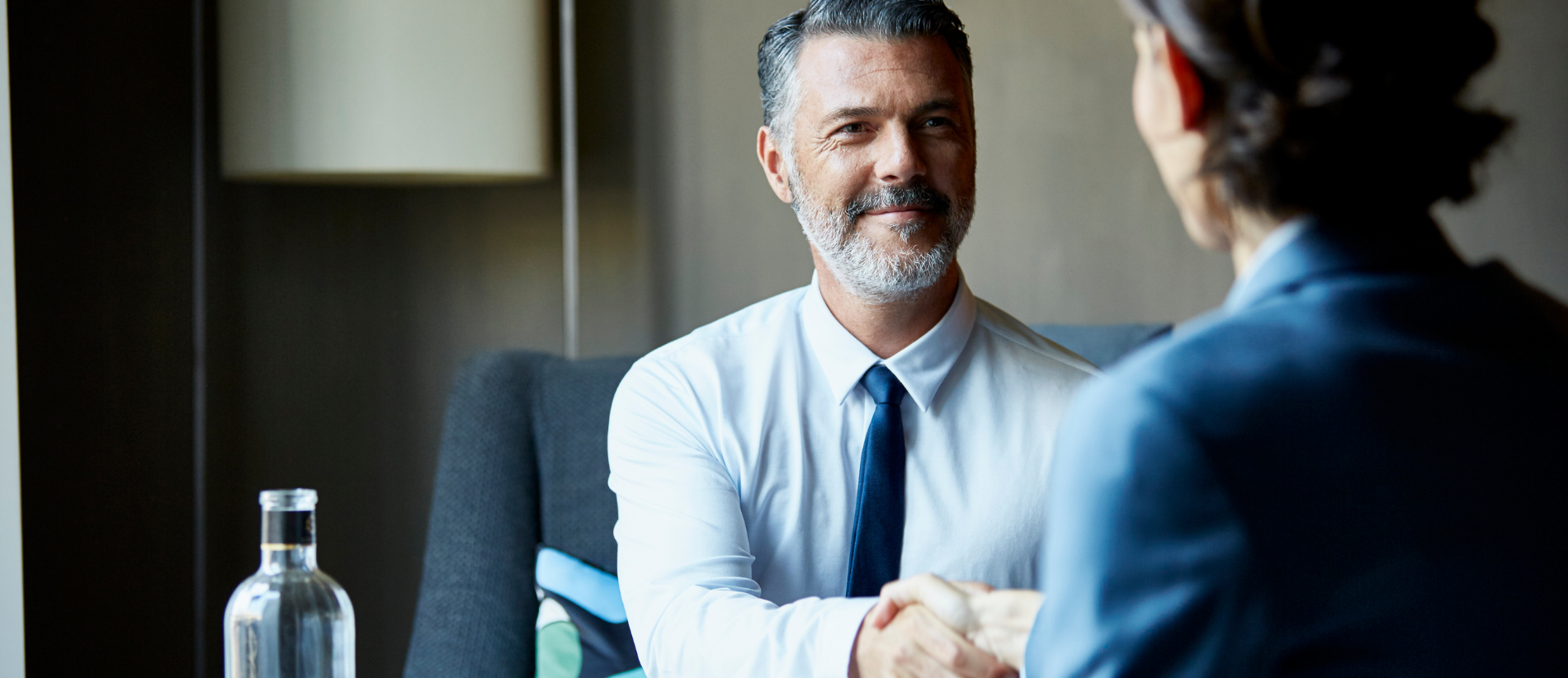 Business people shaking hands after successful business meeting.