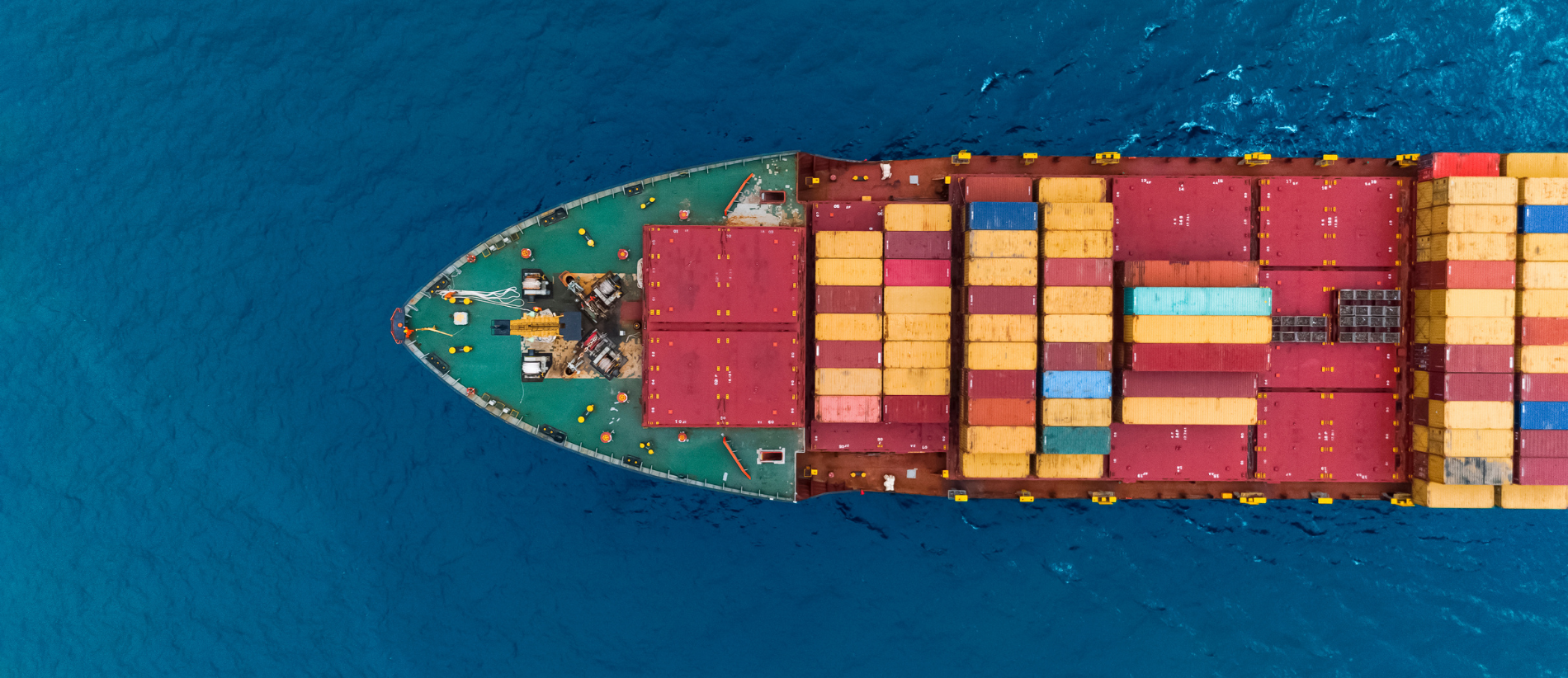 Aerial view of cargo ships in containers sailing in the sea