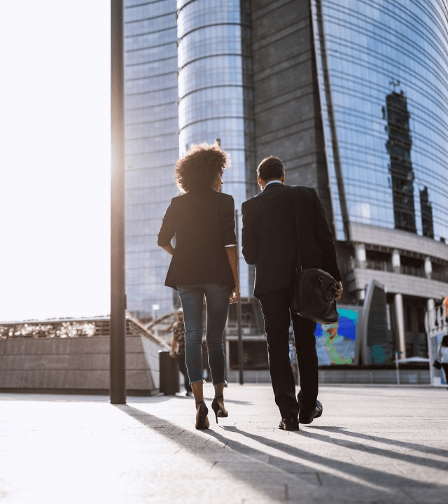 Handsome Couple Walking Home From Work In Streets Of Milan, Italy.