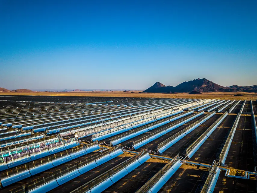 A high view of parabolic trough collectors at the Xina solar energy generation plant in the desert near Keimoes in the Northern Cape, South Africa.