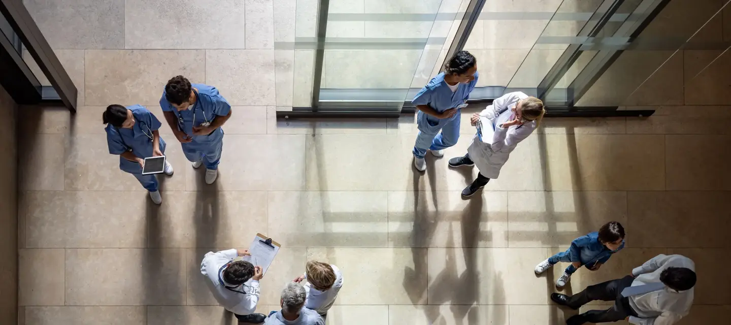 Busy entrance hall at the hospital - healthcare and medicine concepts