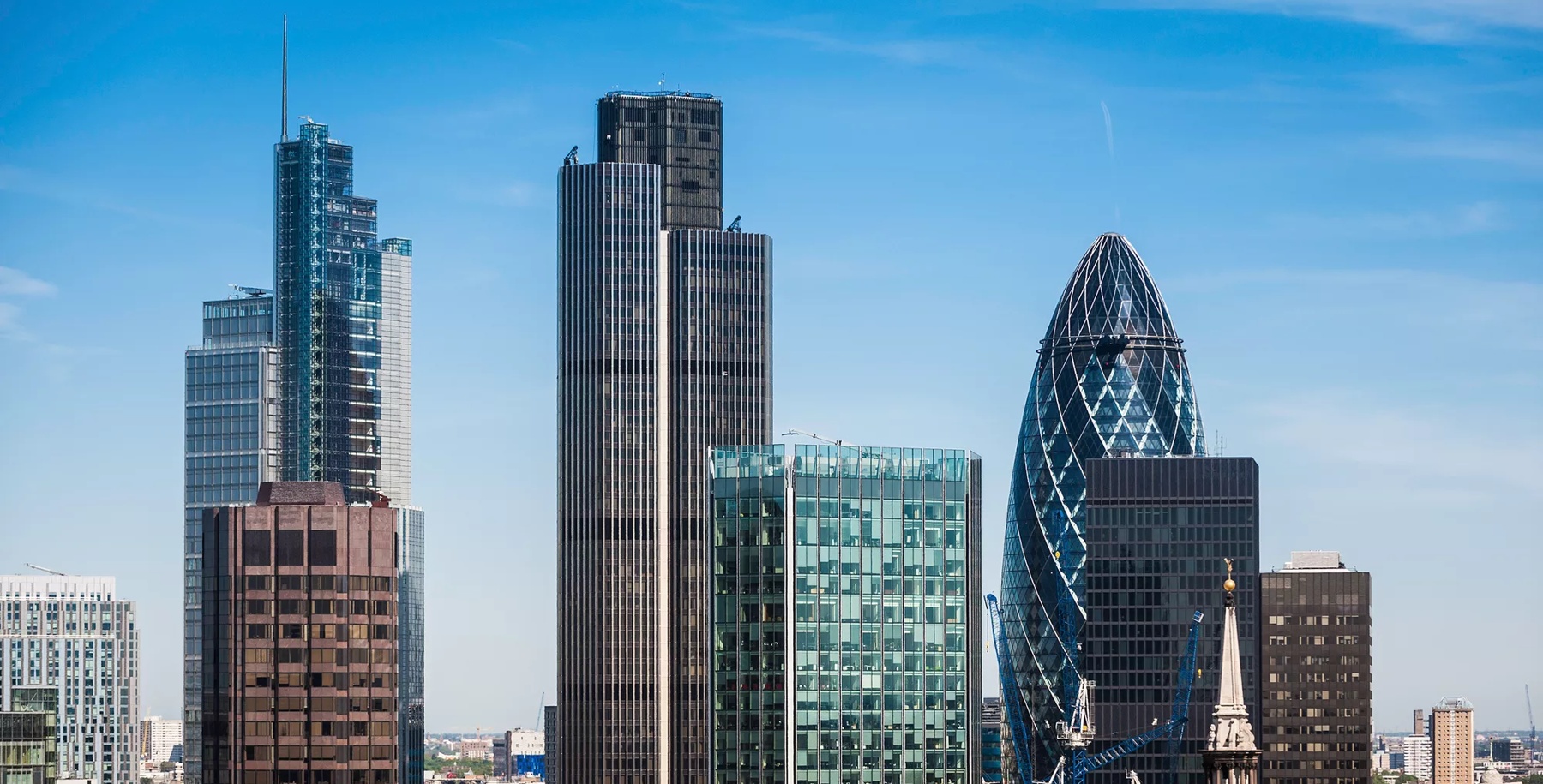 High angle view over the landmark skyscrapers of the City of London Square Mile downtown financial district, the Heron Tower, Tower 42, Broadgate Tower and the Gherkin (30 St. Mary Axe). ProPhoto RGB profile for maximum color fidelity and gamut.