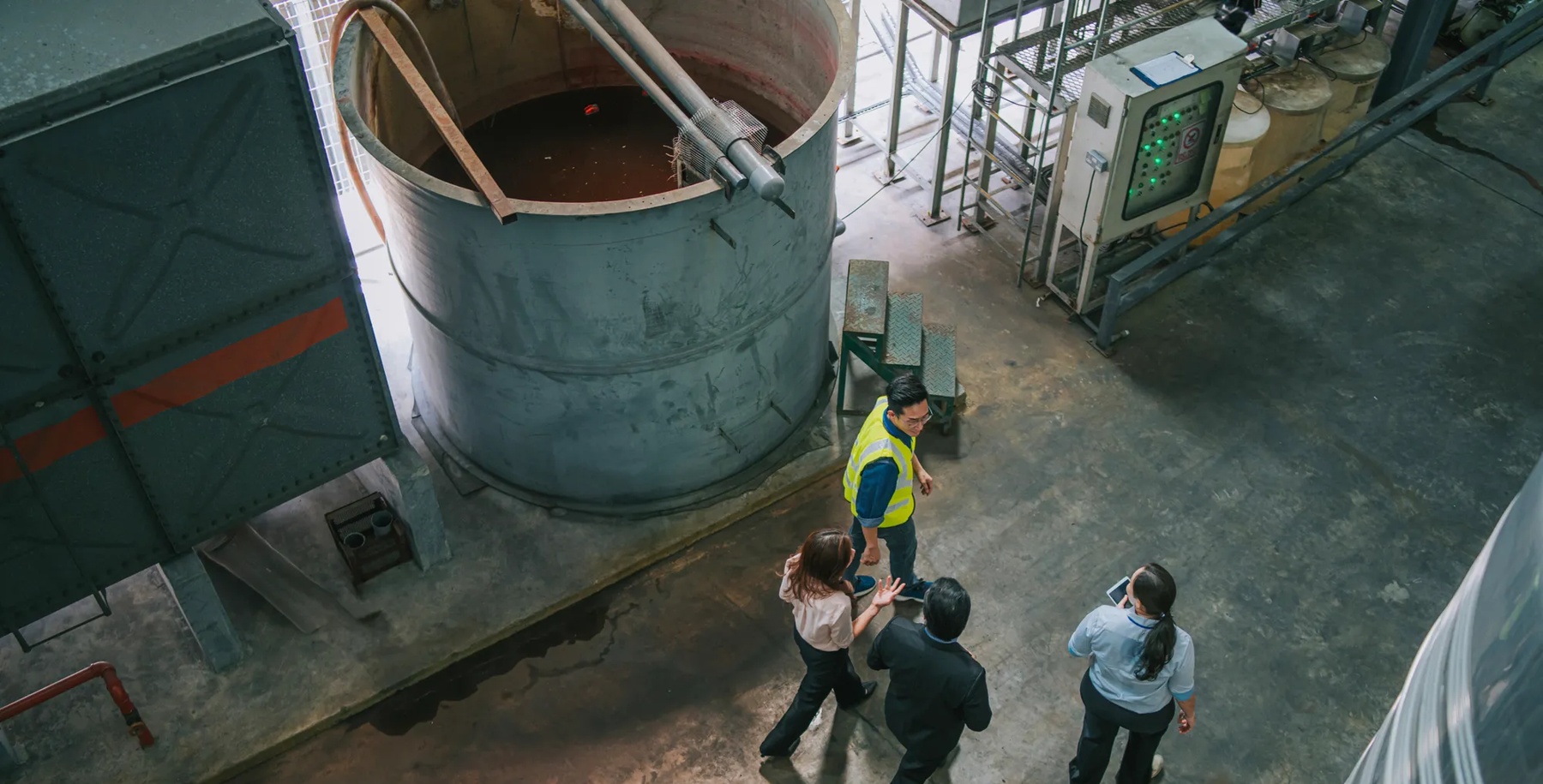 Asian male foreman manager discussion with business man and woman CEO in warehouse company. people discuss of logistics shipping, quality control or export import goods