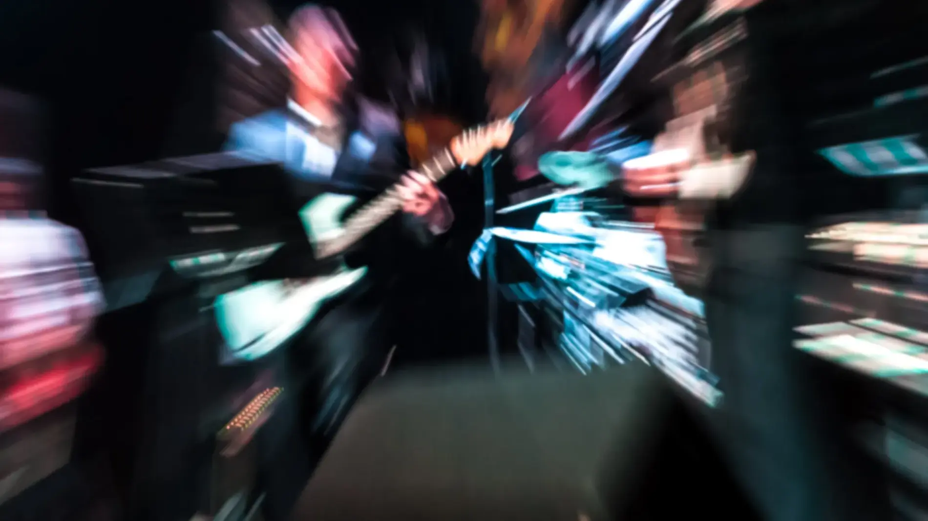 blurred motion of rock musicians on stage
