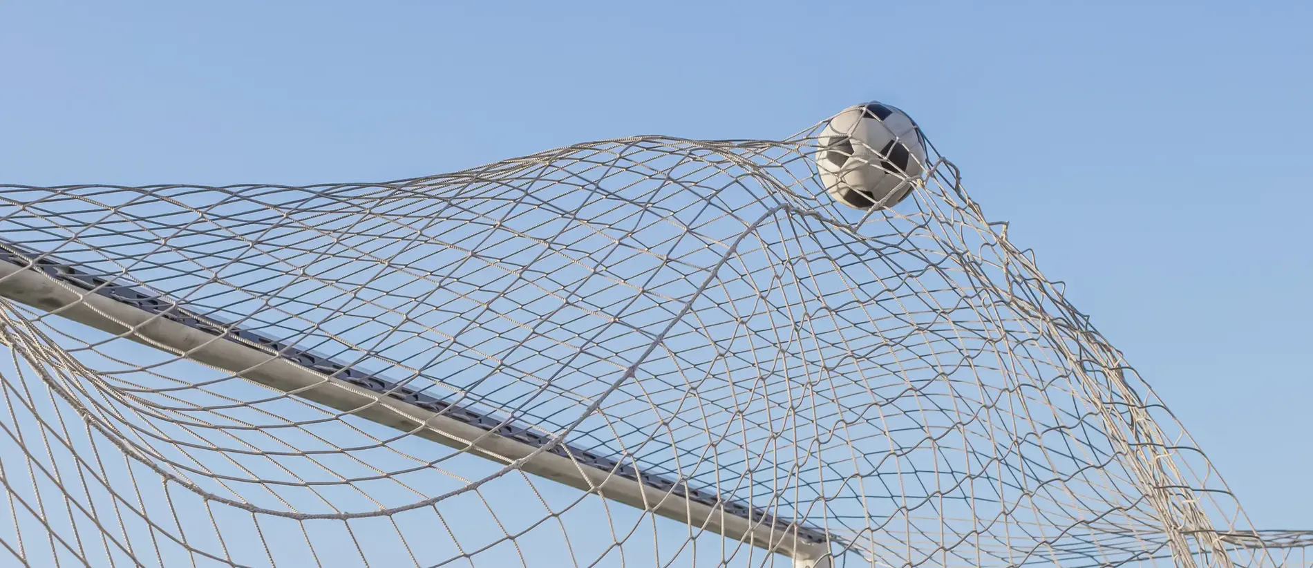 Soccer ball in goal. Football.