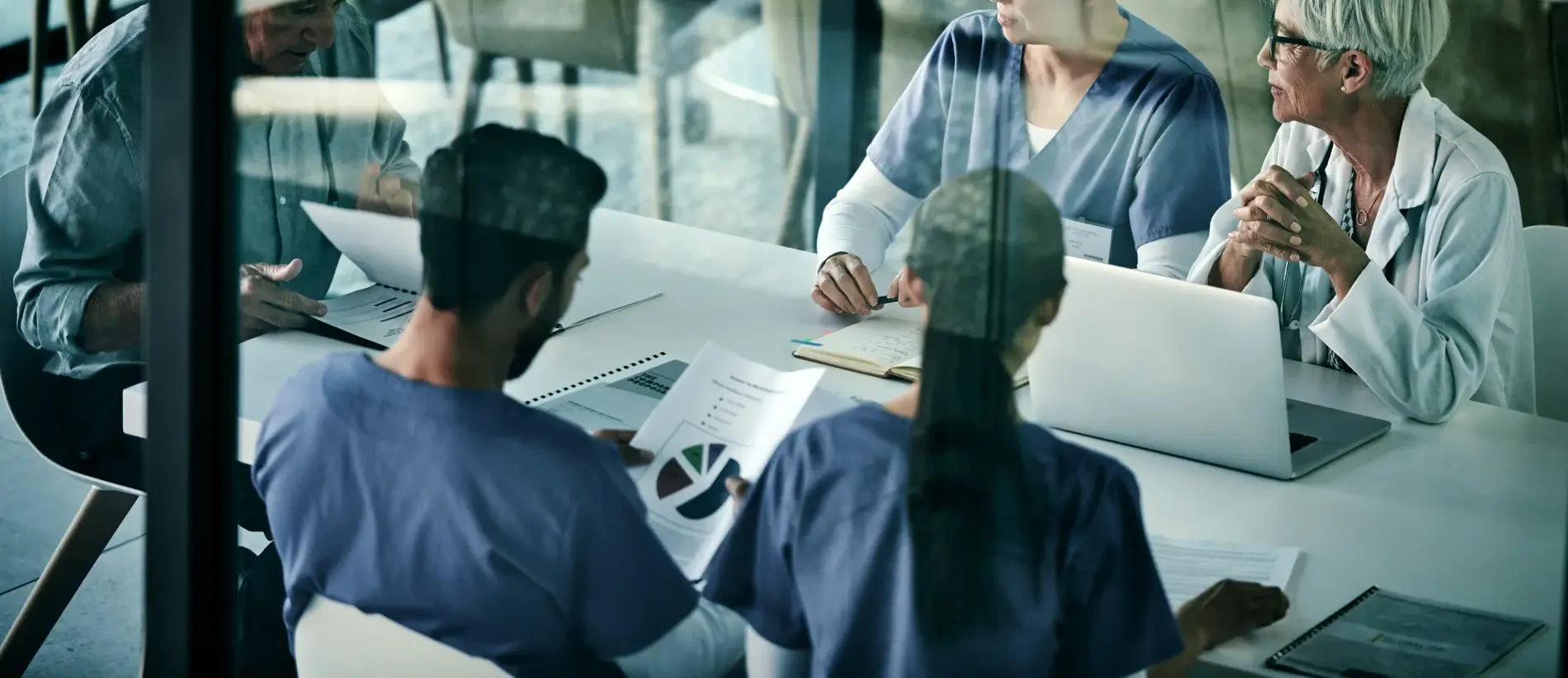 Shot of a group of medical professionals having a meeting together inside a boardroom at a hospital