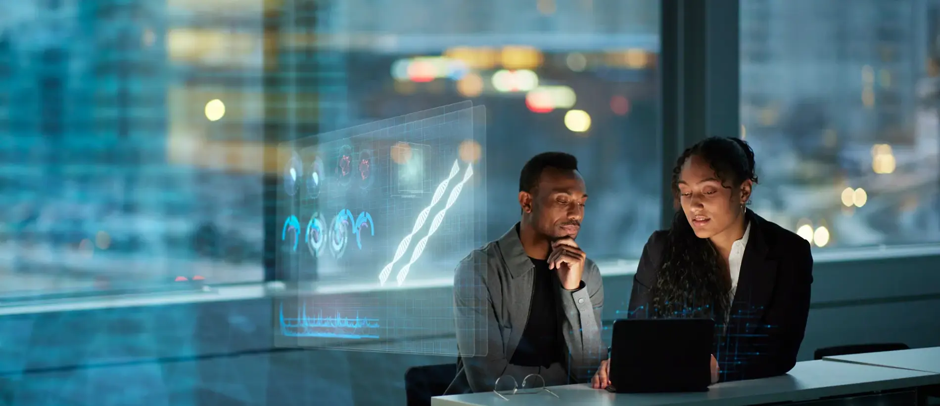 Two young business people working together in office