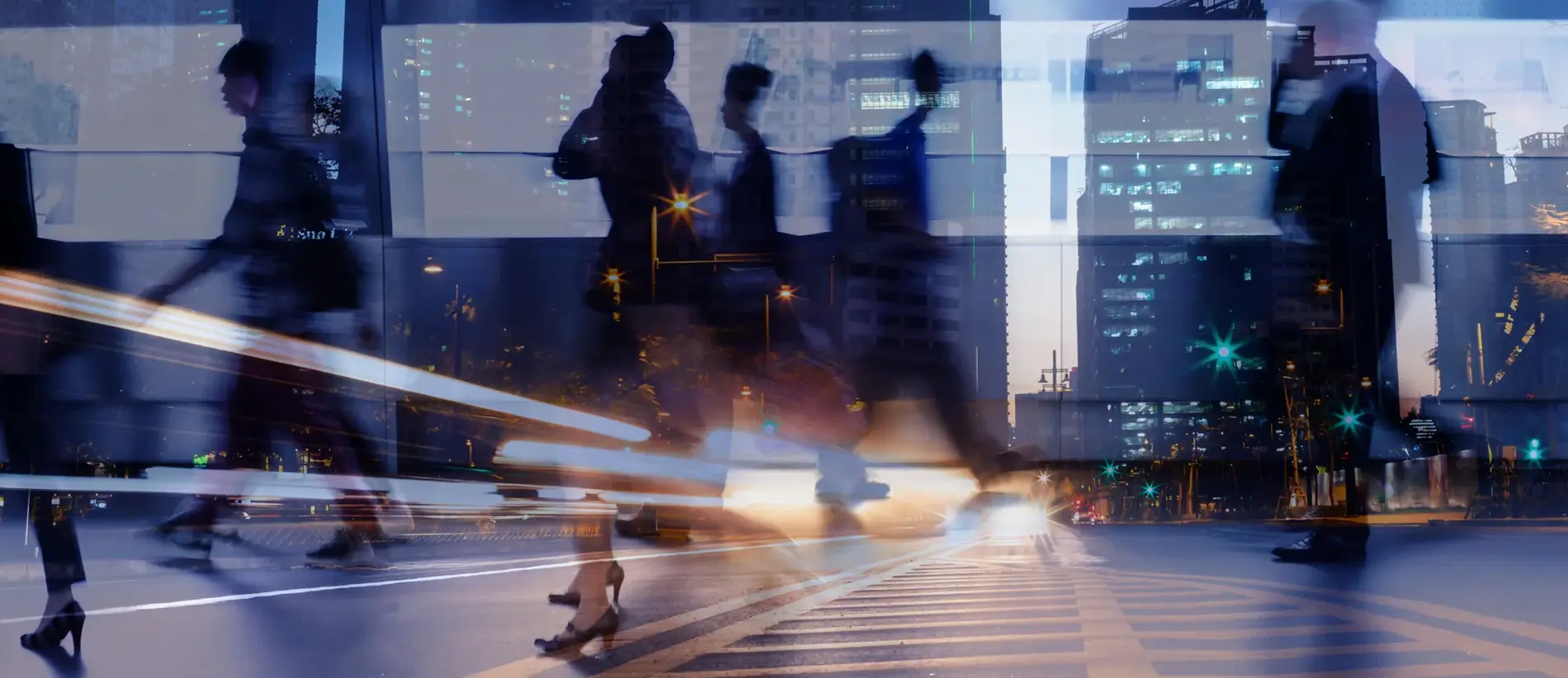 Multiple exposure of business people walking in city