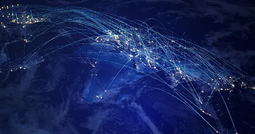 Global network communication on a dark blue background.  (City Lights 2012 - Flat map -https://images.nasa.gov/details-GSFC_20171208_Archive_e001589, Blue Marble: Clouds - https://visibleearth.nasa.gov/images/57747/blue-marble-clouds/57751l)