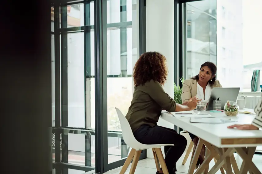 Shot of two businesswomen having a meeting in an office