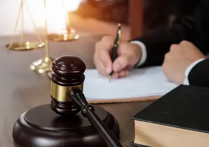 On 21 November 2025, the Government of India brought into effect the four labour codes:
1) The Code on Wages, 2019
2) The Code on Social Security, 2020
3) The Occupational Safety, Health & Working Conditions (OSHWC) Code, 2020
4) The Industrial Relations (IR) Code, 2020
These codes consolidate 29 existing labour legislations into a simplified, modern framework aligned with the needs of India’s evolving workforce and economy.

History
India’s labour laws span nearly 75 years, with several acts enacted during pre-Independence or early post-Independence years in an era where no internet or telecom infrastructure was available, no organized HR systems were in place and there was little to no automation in processes. Moreover, workforce models and business structures have fundamentally transformed with technology enablement, contractor, freelancer, gig-based workers and hybrid and flexible employment arrangements in place.
The new labour codes have been introduced to align India’s labour ecosystem with current realities, simplify compliance, support worker protection and improve ease of doing business for economic growth.
What should employers expect?
While the central rules have been made effective, we should expect more clarity from the government in the coming weeks on the compliance processes, forms, register formats, and safety requirements. Companies
are expected to follow current regulations till clarity on procedural aspects are provided.
Most states have also issued the draft rules, barring a few. The coming weeks may involve multiple notifications clarifying implementation processes. 
While we wait for more clarity, some aspects of the labour codes become effective immediately from 21 November 2025. The definition of employee and worker has been clearly called out, along with recognizing additional workforce models like fixed term employees (FTEs), gig workers, contract labour – and employers can start evaluating their current workforce as per the new codes. A uniform definition of “Wages” has also been clearly called out which will have an impact on calculations related to Gratuity payout, PF, ESI, Leave Encashment, Statutory Bonus and Overtime.
KEY CHANGES & IMPACT AREAS
New ‘Wage’ definition and its implications to employers:
The labour codes standardized the definition of wages across all the four codes, bringing in consistency and clarity to benefit calculations across a wide range of benefits. While this brings uniformity leading to lower administrative complexity and lesser ambiguity on interpretation of salary for benefit payouts, this change will likely have an impact on benefit related costs for employers.
As per the Code of Wages, 2019 the new definition of ‘wage’ is broader in nature and states that if specified exclusions exceed 50% of the total remuneration, the excess must be added back to wages. Which means that wage must be at least 50% of the total remuneration.

Scenario 1 (Exclusions less than 50% of CTC)
Basic Pay: INR 40,000
Excluded Allowances from the definition of wage: INR 40,000
Retaining Allowance: INR 20,000
Total CTC: INR 100,000
In this case, Wage is calculated as INR 40,000 + INR 20,000 = INR 60,000 (Basic + Retaining Allowance)

Scenario 2 (Exclusions greater than 50% of CTC)
Basic Pay: INR 30,000
Excluded Allowances from the definition of wage: INR 60,000
Retaining Allowance: INR 10,000
Total CTC: INR 100,000
In this case, exclusions can be a maximum of 50% of total CTC (50% x 100,000 = INR 50,000), therefore INR 10,000 will be added back to Wages. Hence, wage is calculated as INR 30,000 + INR 10,000 + INR 10,000 = INR 50,000 (Basic + Retaining Allowance + Portion of exclusions added back to wages).

Few aspects to keep in mind:
The Code on Wages, 2019 calls out the various components that can be considered as exclusions from the wage definition, and it is not necessary that the exclusions will be at least 50% of total remuneration. This can  lead to wages being higher than 50% of total remuneration. The perception of increasing basic pay to 50% may not solve for the new definition of wages, and a carefully crafted restructuring of salary components needs to carried out by employers to minimize financial impact of benefit payouts. 
Employers should look at this as an opportunity to restructure their salary components to be simplified, compliant and optimized to minimize financial impact. While employers might still want to retain certain allowances from a tax benefit point of view, various additional allowances that now will form a part of wage can be consolidated to provide a simplified salary structure to employees. 
Impact to benefit schemes:
The new definition of wage will apply to calculate various benefit schemes like Gratuity, Employees’ State Insurance, Overtime, and Statutory Bonus. These codes aim to enhance social security coverages across various workforce models like permanent employees, fixed term employees, contract labour and gig workers.

GRATUITY
Gratuity will now be calculated on the new definition of wage, which will be at least 50% of the total remuneration (can be higher depending on how the salary components are structured). Prior to the new codes, Gratuity was payable on the last drawn basic salary + dearness allowance which was typically lower than 50% of the total remuneration for most organizations. As a result, employees will receive a higher gratuity benefit as per the new codes and employers will most likely need to recognize a higher provision for this benefit in their books of accounts. 

Provision | Old Provision | New Provisions under Labour Codes
Total monthly CTC | INR 100,000 | INR 100,000
Base for Calculation	| Last drawn monthly basic salary (40% of CTC): INR 40,000	| Last drawn monthly wage (at least 50% of CTC): INR 50,000
Years of Service	| 10 years | 10 years
Gratuity Formula	| 15 days of the last drawn monthly salary, for the number of years of service. |	15 days of the last drawn monthly salary, for the number of years of service.
Gratuity Payable	| INR 230,769 (15/26 x 40,000 x 10)	| INR 288,462 (15/26 x 50,000 x 10)

Retrospective Impact:
While these changes are effective from 21 November 2025, the gratuity formula applied is retrospective, i.e., if an employee has been working for 10 years and decides to leave the organization after 21 November 2025, the Gratuity will be payable on the new definition of wage for the entire 10-year duration that the employee has worked for the company.
Moreover, Gratuity benefit for Fixed Term Employees (FTEs) has been enhanced to be payable on a pro-rata basis for the time they serve the company. The minimum period of service to be eligible for Gratuity has changed to 1 year of service for FTEs. Prior to the new codes, FTEs were eligible to receive Gratuity after 5 years of continuous service. This change will have a significant impact to employers that employ FTEs.
Considering the various changes to Gratuity organizations need to assess the impact to their gratuity benefit scheme and be ready to meet higher gratuity provisions to stay compliant. Those organizations that have funded their gratuity, will need to adjust their funding levels based on the new gratuity liability. The impact on gratuity will vary depending on the company's gratuity policy, for example, for organizations that have an uncapped gratuity scheme will have a higher impact as compared to those employers that have a capped gratuity scheme (i.e., capped to INR 20L). This also gives an opportunity to employers to re-evaluate their gratuity benefit policy to balance the additional benefit provided to employees and the additional cost obligation employers must bear.

PROVIDENT FUND (PF)
The notification issued by the Ministry of Labour and Employment on 21 November 2025 has specifically excluded repealing Employee's Provident Funds and Miscellaneous Provisions Acts (PF Act) and hence the existing PF provisions will continue to be in force until specifically notified by the Ministry of Labour and Employment. However, it is important to note that while the existing PF provisions continue - PF will be paid on the new definition of wage. This means that those employees who have a monthly basic salary lower than INR 15,000 (cap specified as per the PF Act) will benefit from a higher monthly PF contribution which will be on the new definition of wage and not the old definition of basic salary + DA. While this might not be a significant impact, employers will have to ensure these changes are implemented and policies are updated to stay compliant.

EMPLOYEES STATE INSURANCE ACT (ESI)
The coverage of ESI has been expanded to cover all establishments with 10 or more employees, including organized, unorganized, gig and platform workers. A mandatory coverage for all employees in establishments engaged in hazardous occupations. ESI that was previously calculated on gross salary will now be calculated on the new definition of wage, however the cap of INR 21,000 per month remains.
While the coverage of ESI has expanded, the contribution per employee has reduced as wage would be lower than gross salary for an employee. This means that the same ESI benefit will be provided to employees at a lower cost.
This also means that a larger base of employees will be eligible to receive ESI benefits as the wage cap is now INR 21,000 instead of the gross pay cap (i.e. employees with a CTC of up to INR 42,000 will be eligible for this benefit if wage is structured at 50% of CTC). Employers will need to assess the impact of this change and ensure compliance towards this benefit.

MANDATORY ANNUAL HEALTH CHECK-UPS
Employers are now required to provide free annual health check-ups to workers aged 40 and above, promoting preventive healthcare and timely diagnosis. 
Additional key impact areas from Code on Wages, 2019:
1.	National Floor Wage: A national minimum floor wage has been set by the central government to ensure all workers receive a wage at or above a basic standard of living. All states need to comply with this national floor wage and provide a minimum wage equal to or above the national floor wage. This aims to reduce wage differences across geographies and foster nationwide equity.
2.	Working Hours & Overtime: Capped to 48 hours a week. The code provides flexibility to implement a four-day work week (12 hours per day), five-day work week (9.5 hours per day) or a six-day work week (8 hours per day) as long as the cap of 48 hours is not exceeded. Overtime must be paid at double the rate of wages to any work done beyond the normal working hours as defined by the company.
3.	Statutory Bonus: Will now be paid on the new definition of wages. Prior to the codes, the statutory bonus was paid on total remuneration. This implies that a larger group of employees may now qualify for statutory bonus, as eligibility will be determined using the revised wage ceiling of INR 21,000 rather than total remuneration. In effect, employees with a CTC of up to INR 42,000 could fall within the scope of this benefit if wages are structured at 50% of CTC. Employers will need to assess the impact of this change and ensure compliance.
4.	Timely Wage Payment: Wages must be paid on time as defined by the Code. For monthly payment of wages, the payment must be made within 7 days of the following month. For daily payment of wages, the payment must be made at the end of the daily shift. On termination or resignation, the full and final settlement must be completed within two working days. Employers will have to re-look at their processes for payouts to ensure compliance with these timelines. In addition, the government has also called out against discrimination based on gender—with equitable pay to be provided to men and women performing the same or similar work, consent from women working in night shifts and hazardous industries, stringent anti-harassment laws and complaint mechanisms to be adopted by organizations and return to work flexibility for new mothers.
Various categories of workforce defined:
The Codes now clearly define various workforce categories such as permanent employees, fixed-term employees, gig workers, and contract labour. They also distinguish between a 'worker' and an 'employee,' with expanded benefits for workers. Under the new framework, workers will now be entitled to overtime, leave encashment, statutory minimum wages, periodic health check-ups, and enhanced financial security linked to their wages.
The Labour Codes also clarify the role of contract labour and the nature of work they are permitted to undertake. Contract labour is restricted from performing the 'core activities' of an organisation, except under specific circumstances that have been expressly defined.
Fixed term employment is now recognized as an employment model with an aim to equate wages and social security benefits as provided to a permanent worker.
The government has also aimed to define the unorganized sector of gig workers, platform workers and other individuals in the unorganized sector by providing them with certain welfare and social security programs. This population will now be eligible to receive health protection, disability support, maternity benefits, and old-age pension programs via a social security fund. Aggregators are required to maintain a social security fund for gig workers and contribute 1-2% of their annual turnover capped at 5%.
This provides employers an opportunity to relook at their group policies to encompass a larger employee base. It's also important for employers to define their workforce categories as different benefit policies may be applicable across these workforce categories.

Preparing for Transition: How Lockton can help:
These reforms mark a major shift in the regulatory landscape and are expected to affect a large proportion of the workforce, as well as various HR processes and policies. It is therefore critical for organizations to evaluate the implications comprehensively and prepare for a seamless transition to maintain compliance and operational efficiency.
Lockton's approach to ensure a seamless transition is as follows:
1.	Workforce Classification Review: Employers should start by mapping their current workforce structures across permanent, FTEs, contract staff, gig workers. This will involve redesigning job descriptions as per definitions across these workforce models to ensure compliance clarity.
2.	Revamp Employment Contracts: Relook at employment contracts to add clarity around fixed-term roles and their benefit eligibility. Employers will now be required to issue appointment letters to all workers to enhance transparency and provide greater job security.
3.	Evaluate Compensation Structure: Review salary components to adhere to the new definition of wages. You may need to rebalance some salary components to ensure exclusions are close to 50% of total remuneration to minimise cost impact.
4.	Impact to Benefits & Take-home Salary: Model impact of wages on PF, ESI, Gratuity, Statutory Bonus and other benefits to assess eligibility and payout quantum and then review the impact on take-home salary of employees.
5.	Benefit Cost Obligations to Employer: Conduct actuarial valuations for defined benefit schemes to assess cost impact. Once cost impact is determined, you will need to evaluate funding strategy to meet the additional cost obligations. Parallelly, assess financial implications for additional benefit provisions like ESI, statutory bonus, annual medical Health check-ups and others.
6.	Compliance Infrastructure Readiness: Assess and upgrade HRMS and payroll systems to align with the new Codes. Update statutory registers and strengthen record-keeping practices as mandated. Review current safety, welfare, and workplace standards to ensure full alignment with the revised requirements.
7.	Policy Revamp: A complete policy redrafting will be required across benefits, policies and processes (Gratuity, PF, Overtime, Safety, Attendance, Working hours, Grievance redressal, etc.)
8.	Change Management: The new codes will impact most employees in the organization, and a clearly crafted communication strategy needs to be in place. Employees, managers, leaders, HR teams (across payroll, benefits, operations, HR systems), compliance, legal and external vendors all need to be made aware of the changes and how this impacts each function. Managers and supervisors need to be equipped to answer employee queries.
9.	Multi-State Compliance Planning: If you are across multiple states, you will need to track ongoing state notifications and build state-specific checklists to ensure compliance across multiple states.

Lockton India is fully equipped to guide employers through every stage of this transition.

If you are seeking a trusted partner to help you navigate these changes seamlessly, please reach out to us at:

ARVIND USRETAY
Head of Human Capital Consulting | People Solutions - Asia
Lockton Companies (Hong Kong) Ltd.
Email: arvind.usretay@lockton.com | Mobile: +852 68975425

-----------------------------------------------------------------------------------------------------------------------

Disclaimer 
Disclaimer
This document prepared by Lockton Services India Private Limited ("Lockton India") is solely for the intended recipient and for informational purposes only. This document does not constitute an offer, solicitation, or recommendation of any product or service. The information contained herein is sourced from publicly available materials. While efforts have been made to ensure accuracy and reliability, no guarantee is provided regarding the completeness, timeliness, or accuracy of the information. This content is for informational purposes only and should not be relied upon as professional, legal, financial, or technical advice. Recipients are encouraged to independently verify any information and consult their tax, legal, or financial advisors before making decisions based on it. Any unauthorised distribution, reproduction, or sharing of this document with external parties or third parties is strictly prohibited without prior written consent from Lockton India. The information provided is subject to change based on market conditions, regulatory updates, and company policy. Lockton India reserves the right to modify or withdraw any content in this document at its discretion. Lockton India, its employees, officers, directors and group companies shall not be responsible or liable for any damages or losses incurred as a result of any information contained in this document.

SAANYA BAWA
Executive Vice President | People Solutions - India
Lockton Services India Pvt. Ltd.
Email: saanya.bawa@lockton.com | Mobile +91 9811820590