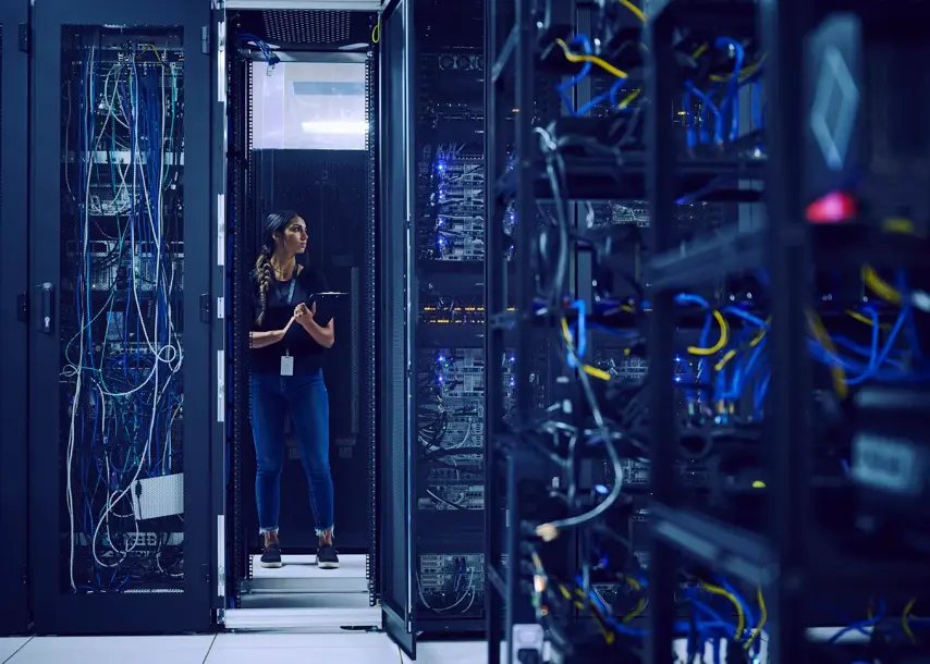 USA, Utah, St. George, Female technician standing in server room