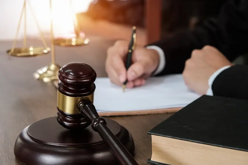 Law, lawyer attorney and justice concept, male lawyer or notary working on a documents and report of the important case in the law firm,bangkok,thailand