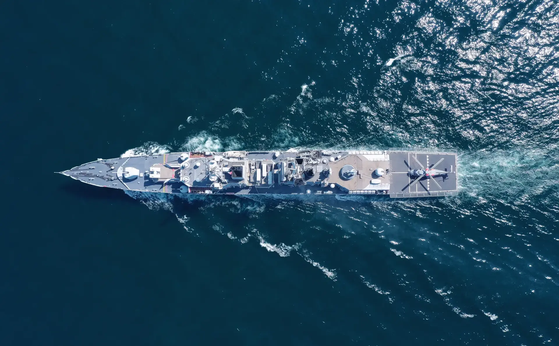 Aerial view of naval ship, battle ship, warship, Military ship resilient and armed with weapon systems, though armament on troop transports. support navy ship. Military sea transport.
